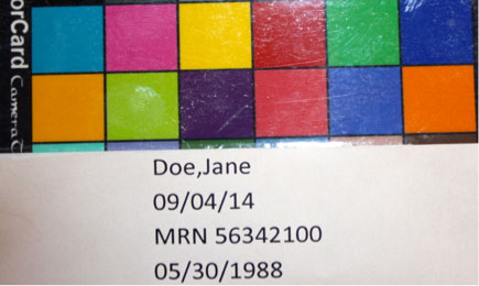 Forensic examination photo of a patient’s demographic information and color card
